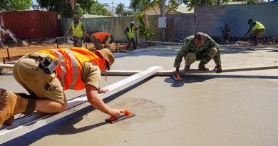 Corporal Gary Beattie, left, works alongside Timor-Leste Defence Force soldiers on a construction site during Exercise Hari'i Hamutuk 2020. Photo by Captain Caitlin McDermid.