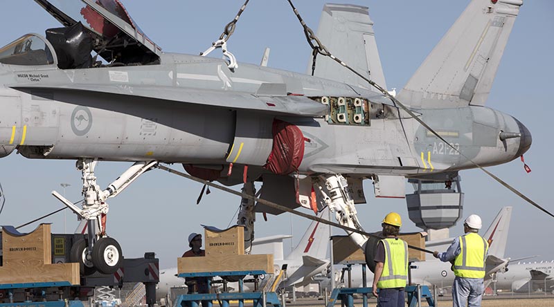 F/A-18A Hornet A21-022 is lifted onto stands at RAAF Base Williamtown in preparation for its move to the Australian War Memorial, Canberra. Photo by Sergeant Brett Sherriff.