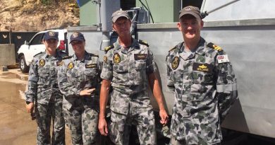 Able Seaman Deneki Stewart, Leading Seaman Tanya Maksimovic, Petty Officer David Neaves and Lieutenant Jared Willans with the fly-away survey equipment they used to find a submerged Army watering hole.