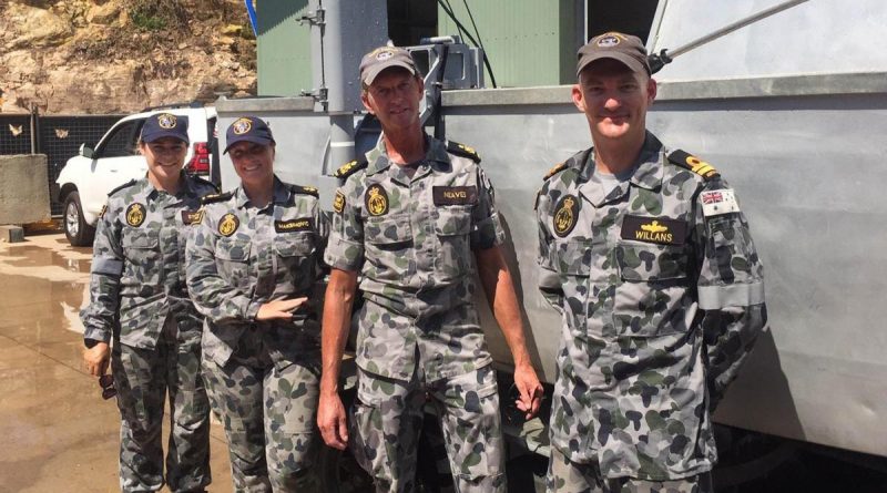 Able Seaman Deneki Stewart, Leading Seaman Tanya Maksimovic, Petty Officer David Neaves and Lieutenant Jared Willans with the fly-away survey equipment they used to find a submerged Army watering hole.