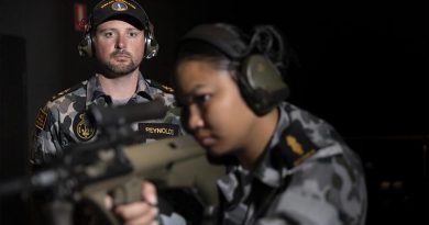 Leading Seaman Bradley Reynolds supervises Able Seaman Armilyn Pontanes during a live-fire serial at the new Weapons Training Simulation System at HMAS Penguin. Photo by Leading Seaman Nadav Harel.