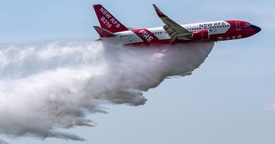 The NSW Rural Fire Service Boeing 737 large air tanker drops a load of water over RAAF Base Richmond. Photo by Corporal Dan Pinhorn.