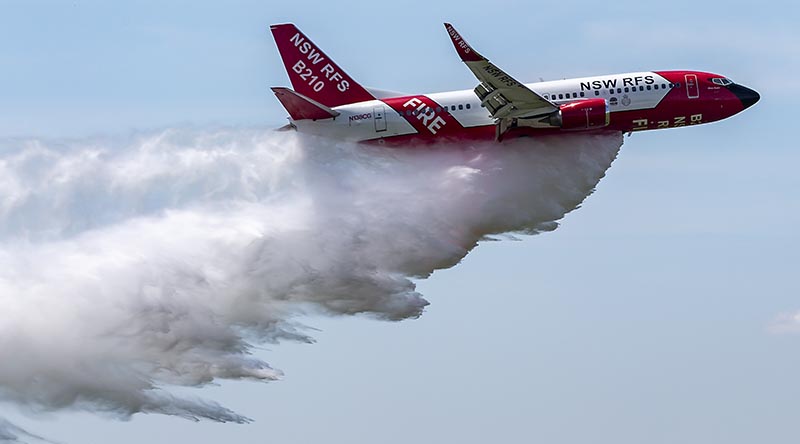 The NSW Rural Fire Service Boeing 737 large air tanker drops a load of water over RAAF Base Richmond. Photo by Corporal Dan Pinhorn.