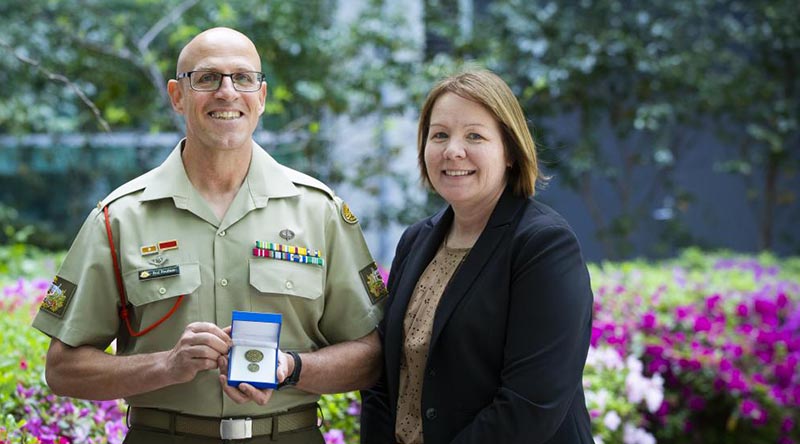 Warrant Officer Class 1 Rod Rootham with his wife Warrant Officer Class 2 Jo Rootham after receiving a Vice Chief of the Defence Force Gold Commendation in Canberra. Photo by Kym Smith.