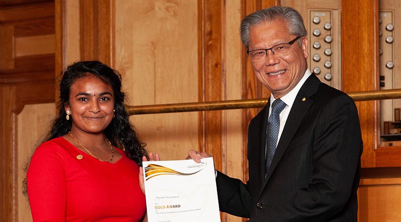 Tharane Thamodarar receives her Duke of Edinburgh’s International Award Gold Award certificate at Adelaide Town Hall from Governor of South Australia Hieu Van Le. Image courtesy of The Duke of Edinburgh’s International Award – South Australia.