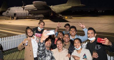 Timorese students happy to be boarding a Royal New Zealand Air Force C-130H Hercules for a flight home. NZDF photo.