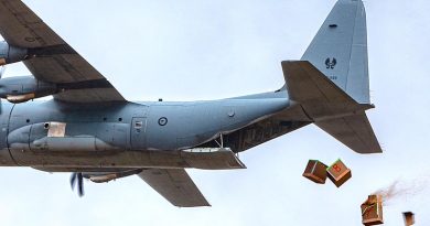 Bundles of livestock fodder fall from a No. 37 Squadron C-130J Hercules during an Air Mobility Training and Development Unit trial at Londonderry, NSW. Photo by Corporal David Said.