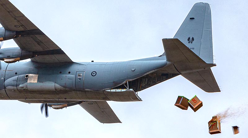 Bundles of livestock fodder fall from a No. 37 Squadron C-130J Hercules during an Air Mobility Training and Development Unit trial at Londonderry, NSW. Photo by Corporal David Said.