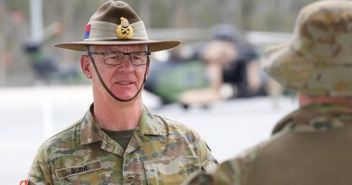 Chief of Army Lieutenant General Rick Burr talks to a soldier at Greenbank Training Area, Queensland. Photo by Corporal Colin Dadd.