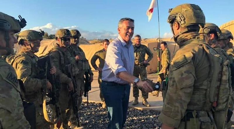 Minister for Veterans Affairs and Minister for Defence Personnel Darren Chester greets Australian soldiers in the Middle East. From Darren Chester's Facebook page.