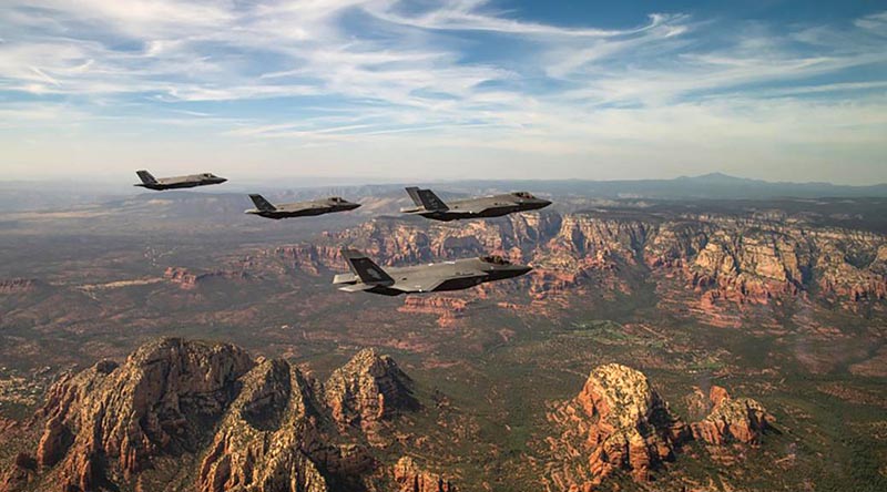 Two USAF and two RAAF F-35A Lightning II aircraft assigned to the 61st Fighter Squadron at Luke Air Force Base, Arizona, fly in formation during a commemoration flight. Photo by USAF Staff Sergeant Alexander Cook.