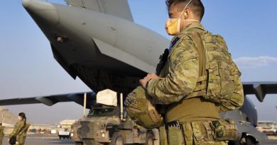 RAAF Corporal Daniel Cafaro guards a RAAF C-17 at Hamid Karzai International Airport in Kabul, Afghanistan. Photo by Corporal Tristan Kennedy.