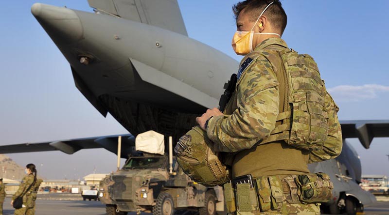 RAAF Corporal Daniel Cafaro guards a RAAF C-17 at Hamid Karzai International Airport in Kabul, Afghanistan. Photo by Corporal Tristan Kennedy.