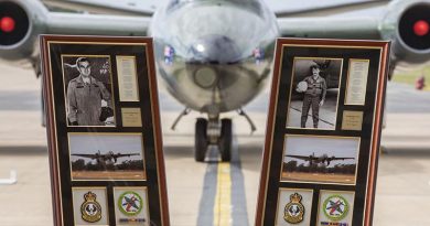 Framed commemorations of Flying Officer Michael Herbert and Pilot Officer Robert Carver positioned in front of a Canberra bomber during a 50th anniversary commemorative service at RAAF Base Williamtown. Photo by Corporal Brett Sherriff.