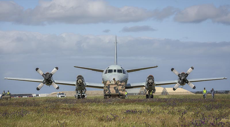 An M-113 armoured recovery vehicle from Army's 1st Combat Service Support Battalion tows Royal Australian Air Force AP-3C Orion A9-658 'cross-country' during its relocation to the front gate of RAAF Base Edinburgh, South Australia. Photo by Corporal Brenton Kwaterski.