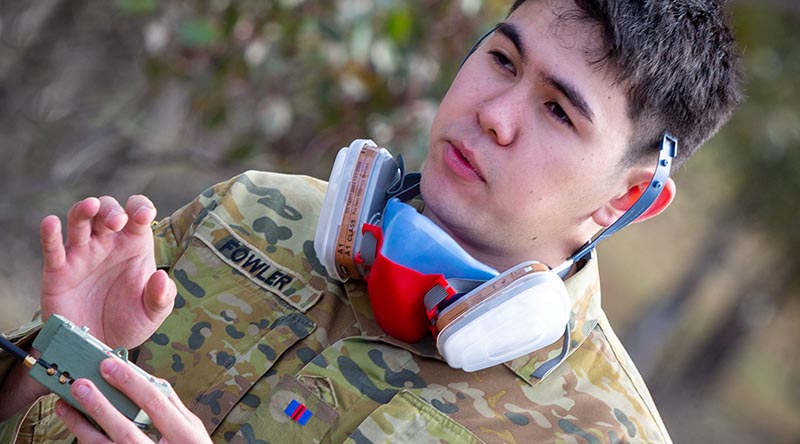 Army Staff Cadet Oscar Fowler from the Royal Military College Duntroon explains his prototype chemical-threats sensor. Photographer unnamed.