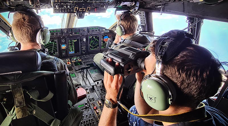 Crew on a RAAF C-27J Spartan scan south-west Pacific seascape for illegal fishing. Photographer unknown.