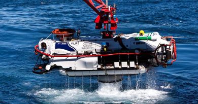 The LR5 submersible clears the water as it begins its recovery after a successful personnel transfer with HMAS Farncomb in the East Australian Exercise Area during Exercise Black Carillon 2013. Photo by Leading Seaman Brenton Freind.