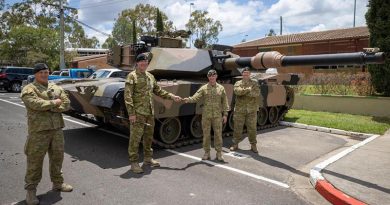 Sergeant Craig Cole, left, Warrant Officer Class 2 Matthew Watt, Corporal Joshua Cavanagh and Lieutenant Colonel Simon Croft stand in front of the M1A1 Abrams Main Battle Tank. Photo: Trooper Jonathan Goedhart