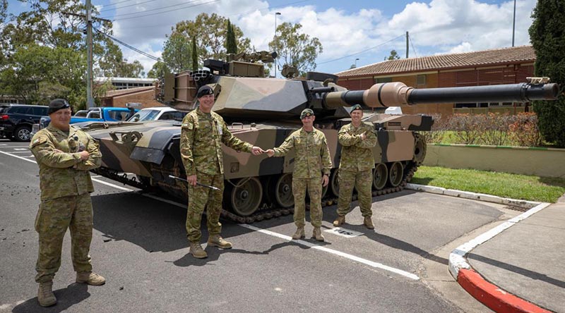 Sergeant Craig Cole, left, Warrant Officer Class 2 Matthew Watt, Corporal Joshua Cavanagh and Lieutenant Colonel Simon Croft stand in front of the M1A1 Abrams Main Battle Tank. Photo: Trooper Jonathan Goedhart