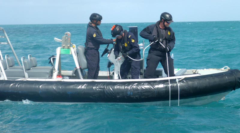 Maritime Border Command personnel deploy one of five hydrophones in the Torres Strait to detect illegal boat movements. ABF photo.