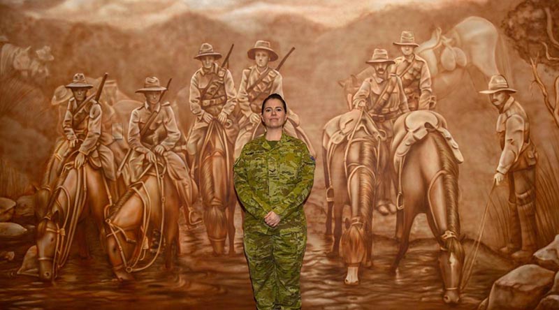 Lance Corporal Jessica Haines-Hann in front of the mural she painted at the Gallipoli Barracks Sergeants' Mess.