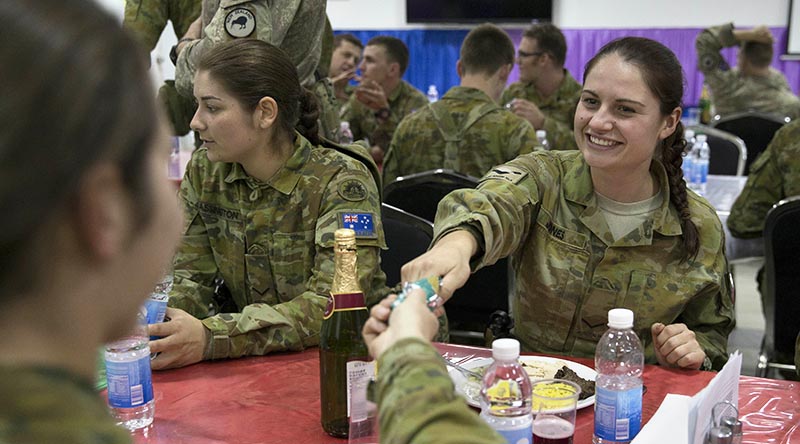 Australian Army Lance Corporal Ella Jones enjoying Christmas festivities at Taji Military Complex, Iraq. Photo by Corporal Steve Duncan.