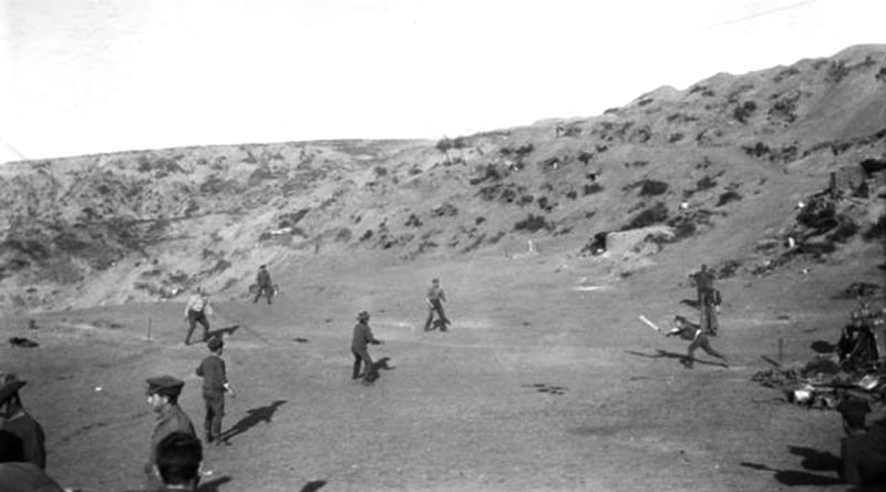 Major George Macarthur Onslow of the Light Horse plays and awkward ball and is caught out during a cricket match played on Shell Green, Gallipoli, as one of many distractions used to fool the Turks about the imminent withdrawal of allied troops. AWM G01289.