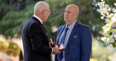 Governor-General of Australia General David Hurley says a few private words to Teddy Sheean's nephew Greg Ivory before officially handing over the Sheean VC. Photo from GG's Facebook page.