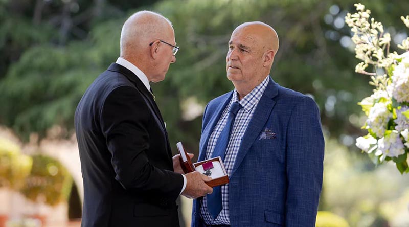 Governor-General of Australia General David Hurley says a few private words to Teddy Sheean's nephew Greg Ivory before officially handing over the Sheean VC. Photo from GG's Facebook page.