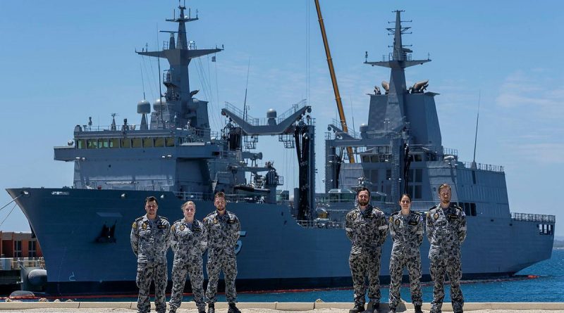 Marine technicians Able Seamen Greg Hallet, left, Cassandra Bullock, Mason Turner, Cody Martin, Yassi Coban and Leading Seaman Morse Stanton in front of NUSHIP Supply at Fleet Base West, Western Australia. Photo by Leading Seaman Ronnie Baltoft.