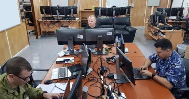 Corporal Mitchell Webster, left, Joel Palmer and Corporal Aaron Bartlett competing in the 2020 Cyber Warrior Challenge.