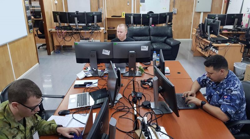 Corporal Mitchell Webster, left, Joel Palmer and Corporal Aaron Bartlett competing in the 2020 Cyber Warrior Challenge.