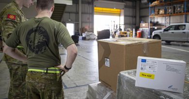 ADF personnel in the Middle East prepare a load of COVID-19 test kits for delivery to Afghanistan. Photo by Sergeant Ben Dempster.