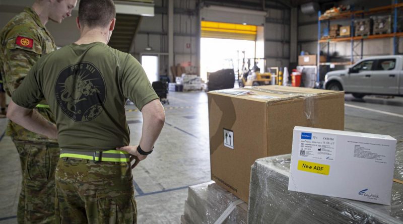 ADF personnel in the Middle East prepare a load of COVID-19 test kits for delivery to Afghanistan. Photo by Sergeant Ben Dempster.