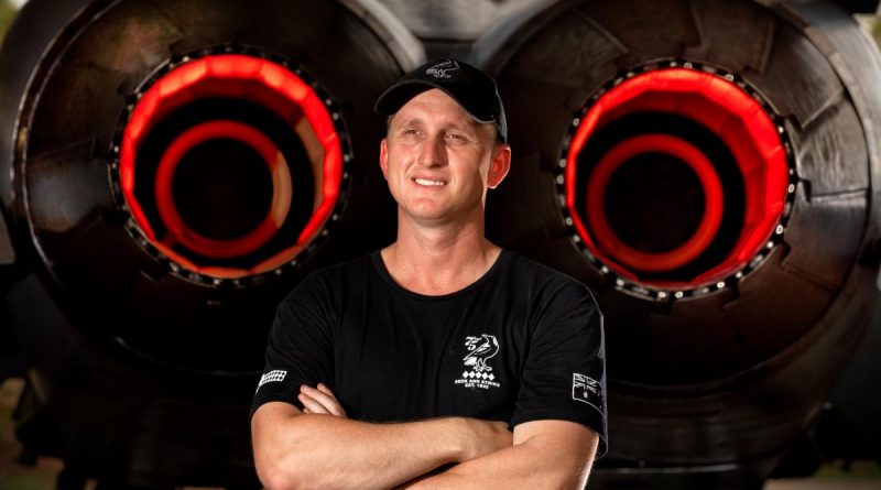 Corporal Brody Peate, a No. 75 Squadron aircraft technician, with an F/A-18A Hornet on RAAF Base Tindal. Photo by Corporal David Said.