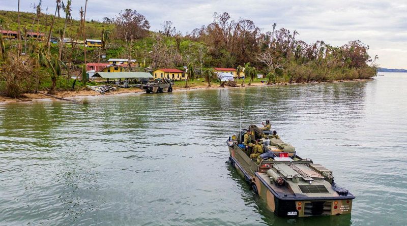 Soldiers from the 10th Force Support Battalion drive a light amphibious resupply cargo 5 onto the island of Galoa, in Fiji to drop off supplies required to repair buildings affected by Cyclone Yasa. Photo by Corporal Dustin Anderson.