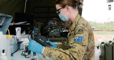 Captain Nicole Eltringham tests water from a desalination system in Vanua Levu on Operation Fiji Assist. Photo by Lieutenant Phillip Qin.