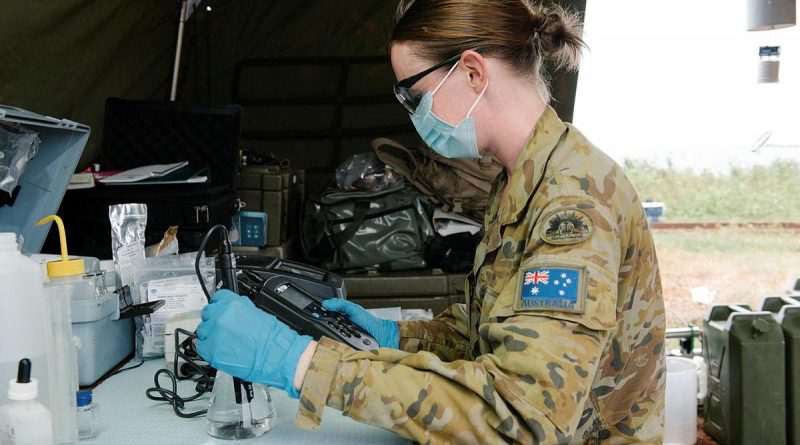 Captain Nicole Eltringham tests water from a desalination system in Vanua Levu on Operation Fiji Assist. Photo by Lieutenant Phillip Qin.