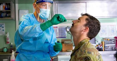 Lieutenant Nicholas Ilijas conducts a COVID-19 test in HMAS Adelaide as part of the COVID-19 safety protocols for Operation Fiji Assist. Photo by Corporal Dustin Anderson.