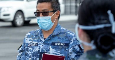 Squadron Leader Harold Cheung briefs Navy personnel at Sydney Airport during Operation COVID-19 Assist. Photo by Leading Seaman Nadav Harel.