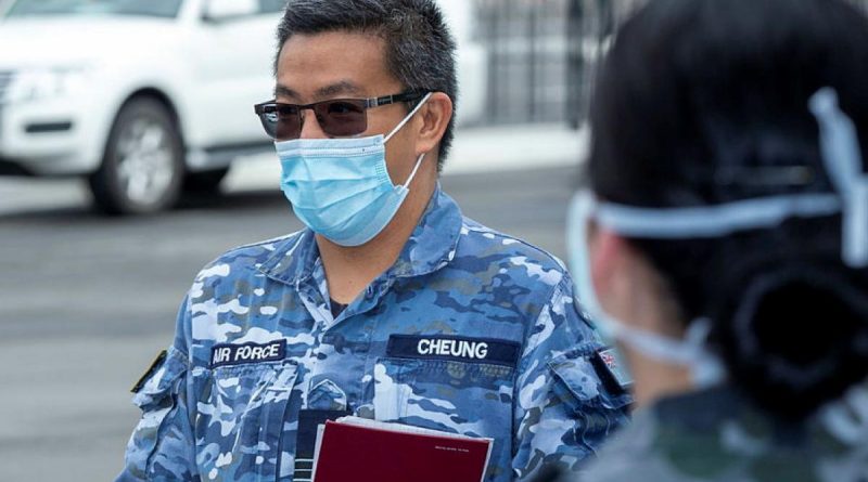 Squadron Leader Harold Cheung briefs Navy personnel at Sydney Airport during Operation COVID-19 Assist. Photo by Leading Seaman Nadav Harel.