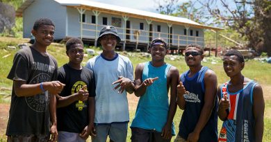 Island of Galoa locals in front of the Galoa Island Primary School repaired by Republic of Fiji Military Forces and ADF personnel from the 6th Engineer Support Regiment. Photo by Corporal Dustin Anderson.