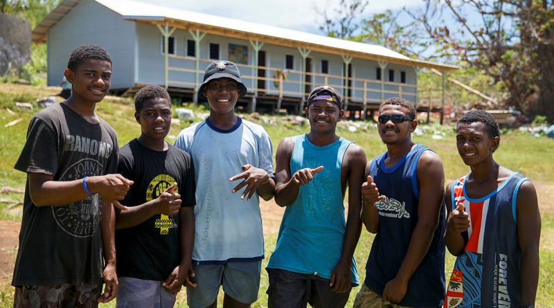 Island of Galoa locals in front of the Galoa Island Primary School repaired by Republic of Fiji Military Forces and ADF personnel from the 6th Engineer Support Regiment. Photo by Corporal Dustin Anderson.