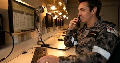 Leading Seaman Christopher Sanders answers a call on board HMAS Adelaide during Operation Fiji Assist. Photo by Corporal Dustin Anderson.