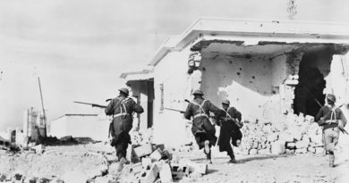 Australian soldiers enter the town of Bardia, Libia, on the second day of the Battle of Bardia. AWM006083 by unknown British official photographer.