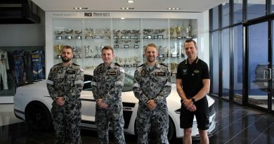 Leading Seaman Damien Smith, left, Able Seaman Nathan Steynberg, Leading Seaman Phillip Cowan and Matthew Roberts at Tickford Racing’s headquarters in Melbourne.
