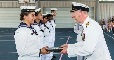 Captain Warren Bairstow congratulates Navy Indigenous Development Program graduate Recruit Chanika Stack at HMAS Cairns. Photo by Andrew Watson.