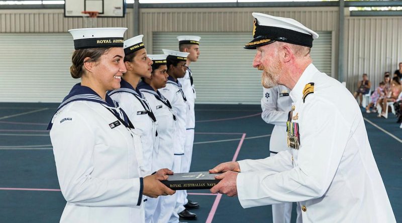 Captain Warren Bairstow congratulates Navy Indigenous Development Program graduate Recruit Chanika Stack at HMAS Cairns. Photo by Andrew Watson.