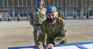 Major General Cheryl Pearce signs a Transfer of Authority certificate appointing Colonel Neil Wright as acting Officer in Charge of the military components in Cyprus until the new force commander arrives. Photographer unknown.